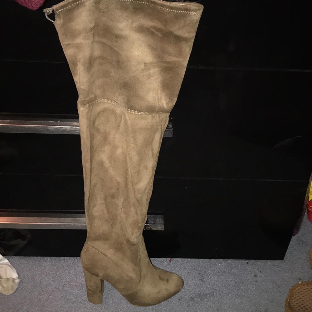 Brown knee high boot heels.